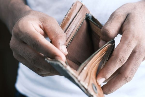 person holding open a empty wallet