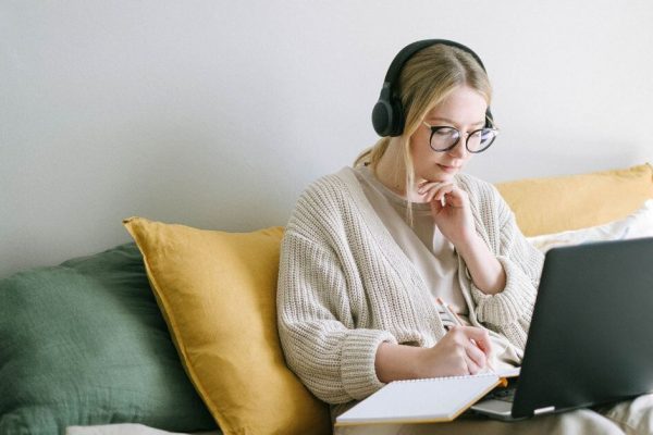 woman on a laptop in headphones